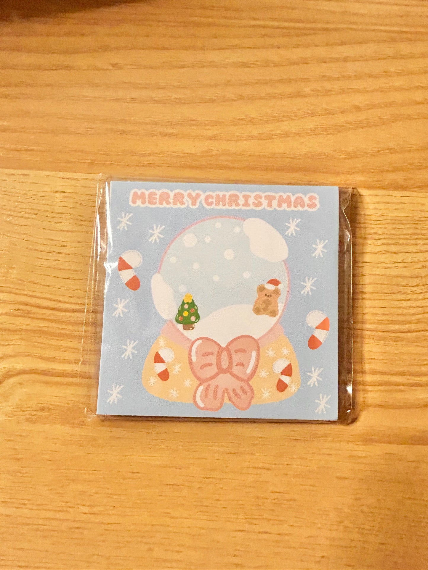 Candy cane snow globe notepad